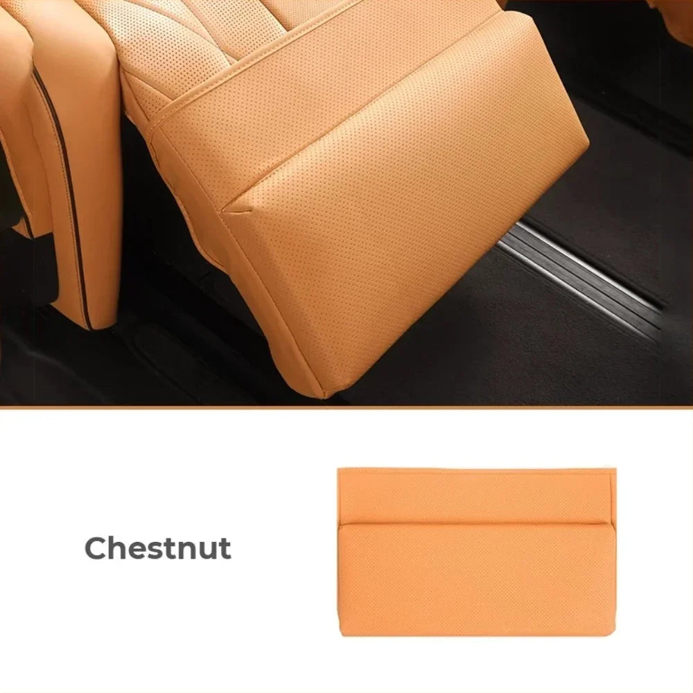 Chestnut brown perforated leather car seat covers with professional stitching.